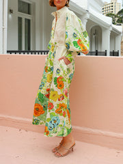 Vestido camisero estilo cárdigan color crema con mangas farol y estampado único