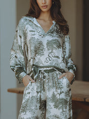 Top holgado de manga larga con estampado floral de jungla de satén