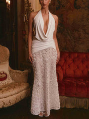 Elegante vestido largo plisado con escote en V profundo y espalda descubierta con estampado floral