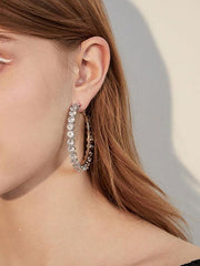 Pendientes circulares grandes con aguja de plata y diamantes exagerados