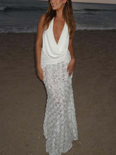 Elegante vestido largo plisado con escote en V profundo y espalda descubierta con estampado floral