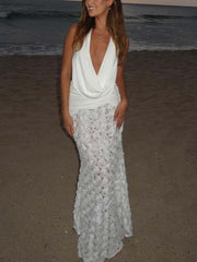 Elegante vestido largo plisado con escote en V profundo y espalda descubierta con estampado floral