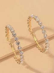 Pendientes circulares grandes con aguja de plata y diamantes exagerados