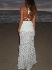 Elegante vestido largo plisado con escote en V profundo y espalda descubierta con estampado floral