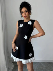 Retro Black Mini Dress with White 3D Floral Appliqués and Ruffle Hem
