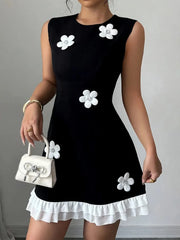 Retro Black Mini Dress with White 3D Floral Appliqués and Ruffle Hem