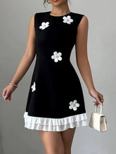 Retro Black Mini Dress with White 3D Floral Appliqués and Ruffle Hem