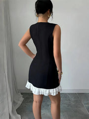 Retro Black Mini Dress with White 3D Floral Appliqués and Ruffle Hem