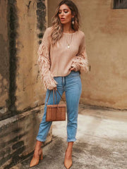 Suéter ajustado de manga larga con borlas de punto