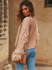 Suéter ajustado de manga larga con borlas de punto