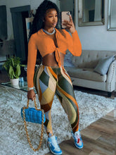 Conjunto de dos piezas de top corto y pantalones de malla