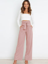 Pantalones acampanados con nudo y cintura alta