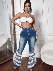 Pantalones acampanados con botones y parches de malla vaquera