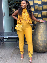 Conjunto de dos piezas de top y pantalones largos calados