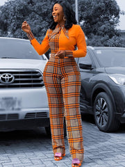 Langärmliger Jumpsuit mit weitem Bein und Karomuster in Farbblock-Optik