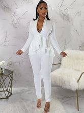 Conjunto de dos piezas de top peplum y pantalones pitillo