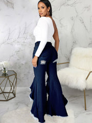 Vaqueros largos de mezclilla con volantes y rotos