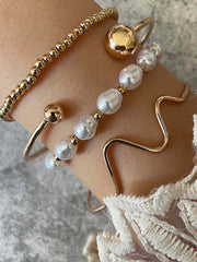 Pulsera elegante de cuatro piezas de perlas