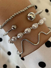 Pulsera elegante de cuatro piezas de perlas
