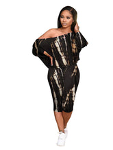 Conjunto de dos piezas de top de un solo hombro y pantalones cortos