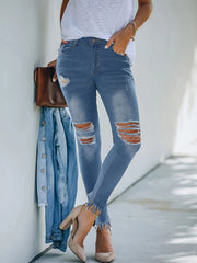 Vaqueros de mezclilla rotos de corte ajustado con botones de mezclilla