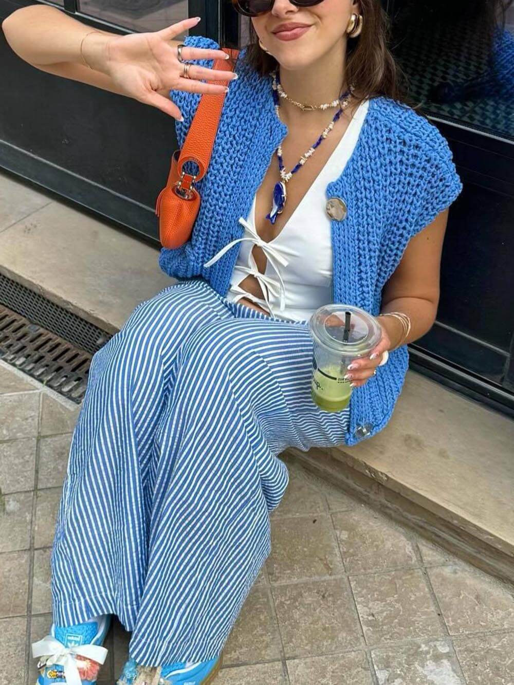 Elegante cárdigan de punto corto sin mangas con bolsillo