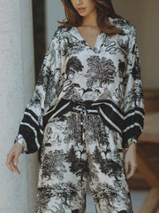 Top holgado de manga larga con estampado floral de jungla de satén