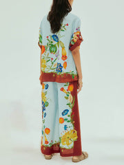 Camisa holgada con botones y estampado floral soleado