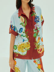 Camisa holgada con botones y estampado floral soleado