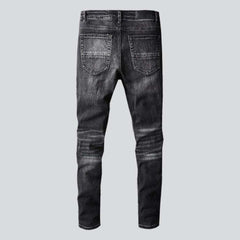 Whiskered distressed black men's jeans