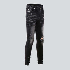 White paint splatters men's jeans