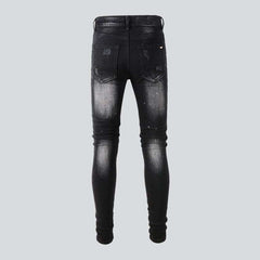 White paint splatters men's jeans